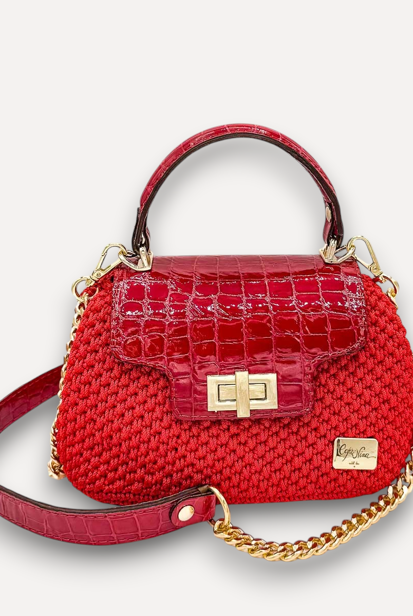 Borsa a mano CapriNina Capriccio rossa in uncinetto con patta in pelle stampa coccodrillo e chiusura a girello oro