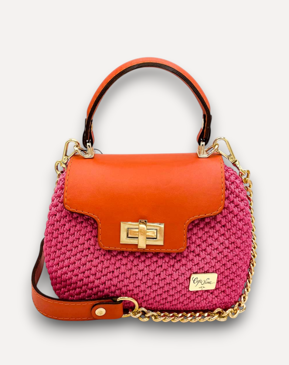 Borsa a mano CapriNina Capriccio in crochet fucsia con patta in pelle arancione e chiusura a girello dorata