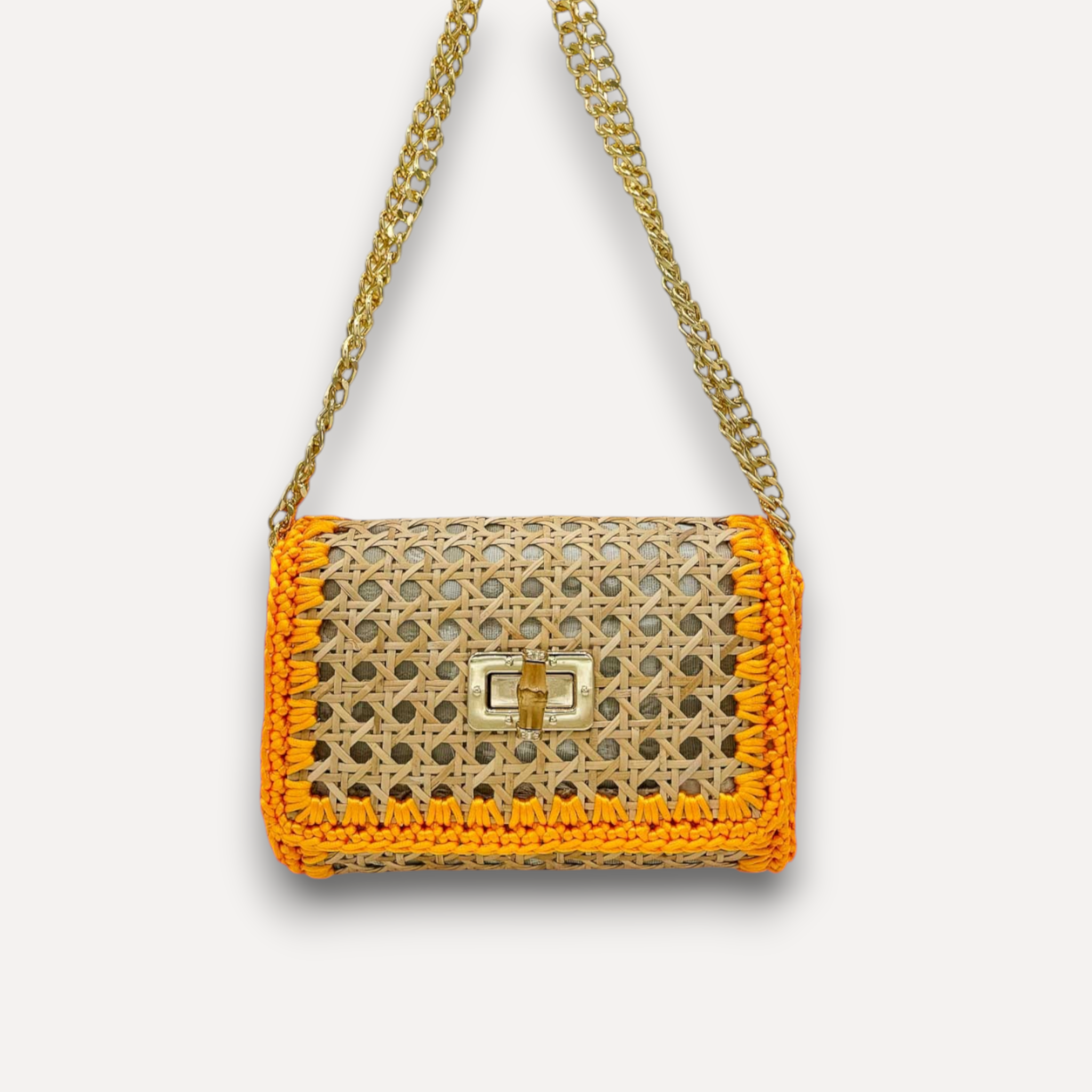 Borsa CapriNina in paglia intrecciata color naturale con bordi in corda arancione e tracolla a catena dorata