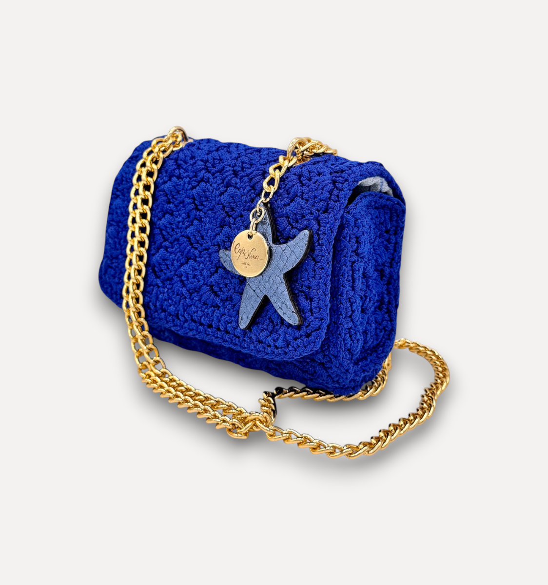 Borsa a tracolla CapriNina Ninetta piccola in crochet blu con catena dorata e ciondolo a forma di stella marina