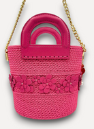 Borsa CapriNina Dodie Flowers fucsia in crochet con dettagli floreali in pelle, manici rigidi e tracolla a catena oro