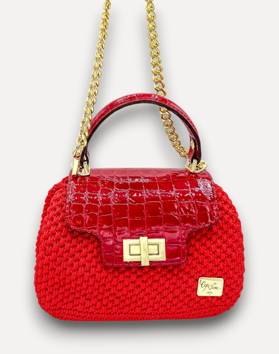 Borsa CapriNina Capriccio rossa in crochet lavorata a mano con patta in pelle stampa coccodrillo e dettagli dorati
